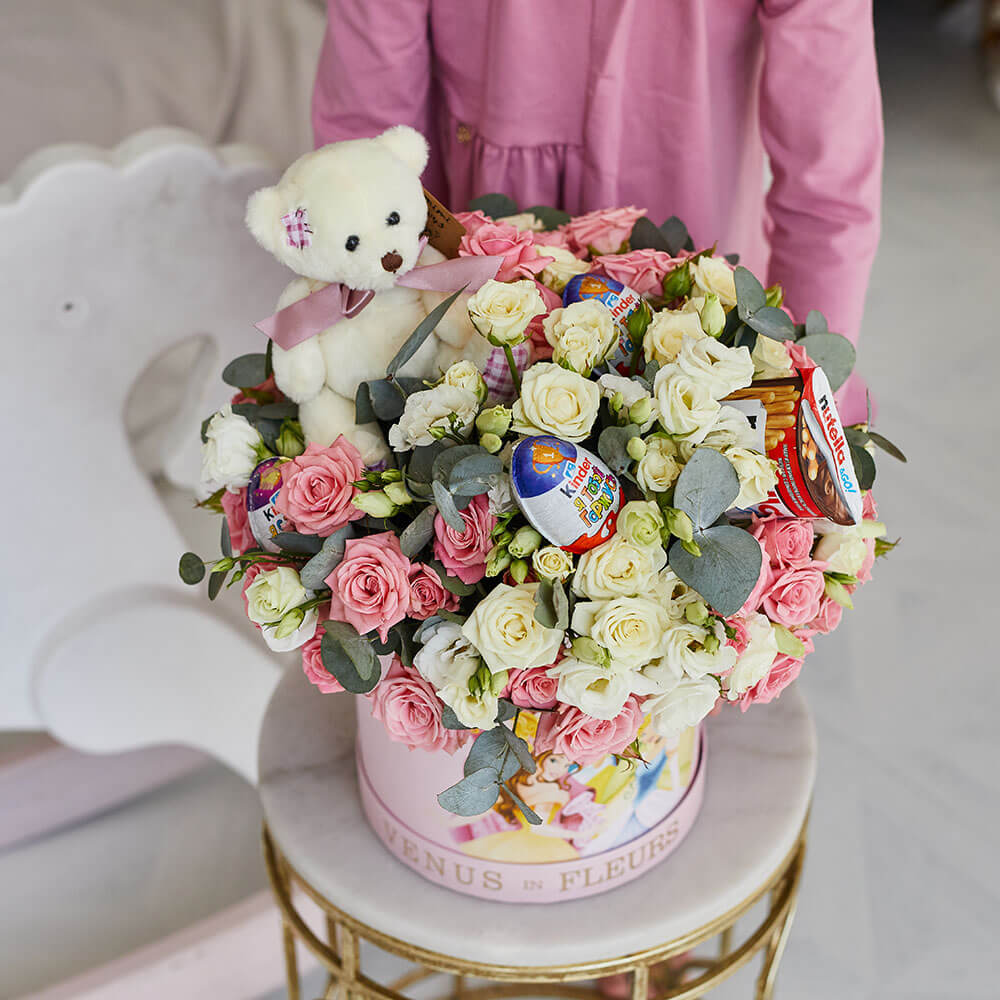 Teddy bear and flower arrangement